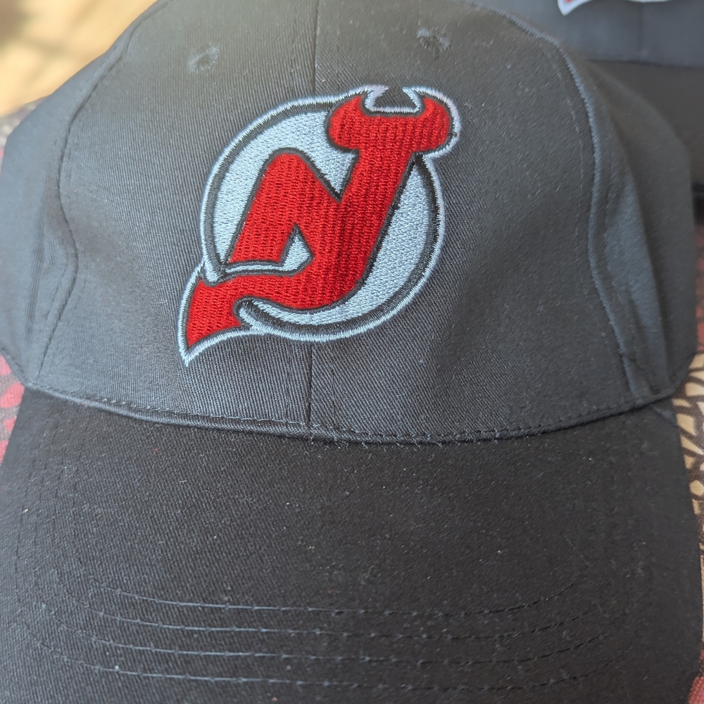 New Jersey Devils Black Cap with Red and White Embroidered Logo.